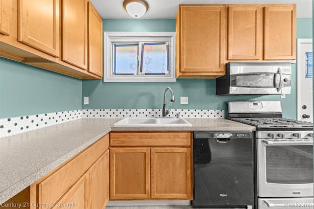 17295 Dora St, Melvindale, MI 48122 - kitchen featuring appliances with stainless steel finishes and light countertops