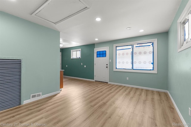 17295 Dora St, Melvindale, MI 48122 - unfurnished living room with light wood-type flooring and recessed lighting