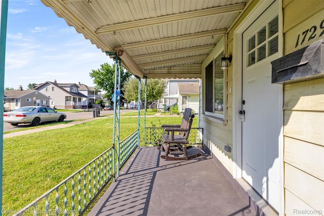 17295 Dora St, Melvindale, MI 48122 - covered porch with a residential view and a lawn
