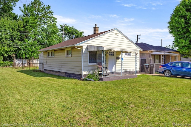 17295 Dora St, Melvindale, MI 48122 - view of front facade with a chimney