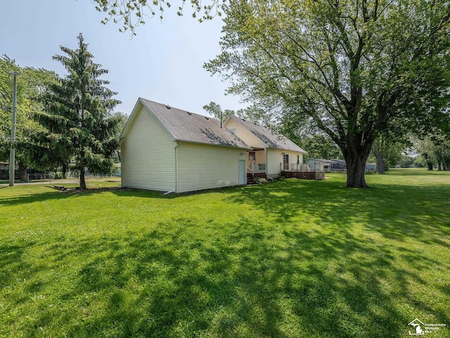 4775 Huron Ave, Newport, MI 48166 - rear view of property featuring a yard and a wooden deck