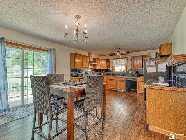 4775 Huron Ave, Newport, MI 48166 - dining space with a textured ceiling, a chandelier, a ceiling fan, and dark wood-type flooring