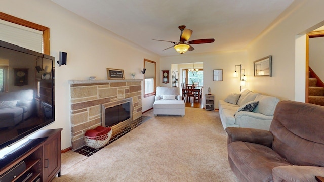 10 Covell Ave NW, Grand Rapids, MI 49504 - living area featuring light carpet, ceiling fan, stairs, and a fireplace