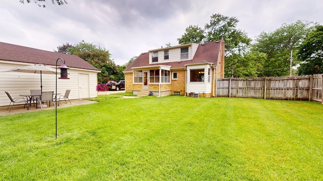 10 Covell Ave NW, Grand Rapids, MI 49504 - back of property with entry steps and a patio area
