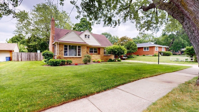 10 Covell Ave NW, Grand Rapids, MI 49504 - view of front of house with brick siding and a chimney