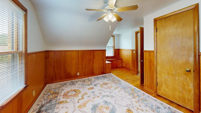 10 Covell Ave NW, Grand Rapids, MI 49504 - bonus room featuring a wainscoted wall, light wood-style flooring, wooden walls, a ceiling fan, and vaulted ceiling