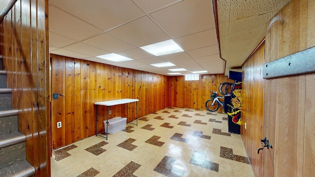 10 Covell Ave NW, Grand Rapids, MI 49504 - finished basement featuring wood walls, tile patterned floors, and a paneled ceiling