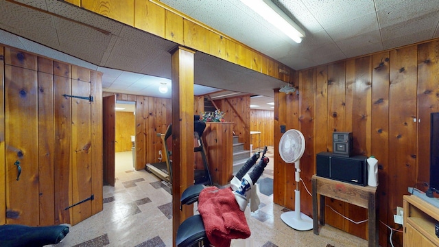 10 Covell Ave NW, Grand Rapids, MI 49504 - finished basement with stairs, tile patterned floors, and wooden walls
