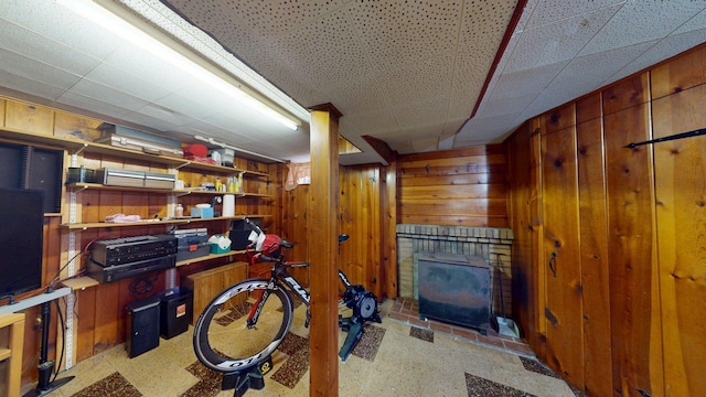 10 Covell Ave NW, Grand Rapids, MI 49504 - finished basement featuring a brick fireplace and wooden walls
