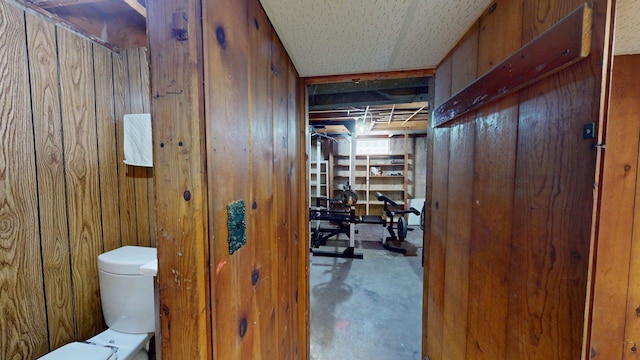 10 Covell Ave NW, Grand Rapids, MI 49504 - half bathroom with wood walls and concrete floors