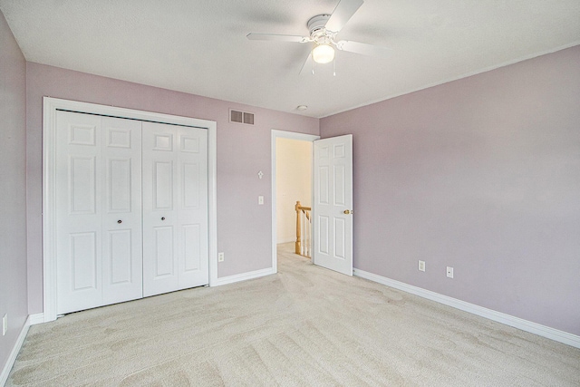 7853 Clydesdale Ave, Kalamazoo, MI 49009 - unfurnished bedroom with light colored carpet, a closet, and a ceiling fan