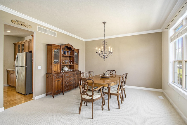 7853 Clydesdale Ave, Kalamazoo, MI 49009 - dining room featuring light carpet, a chandelier, plenty of natural light, and ornamental molding