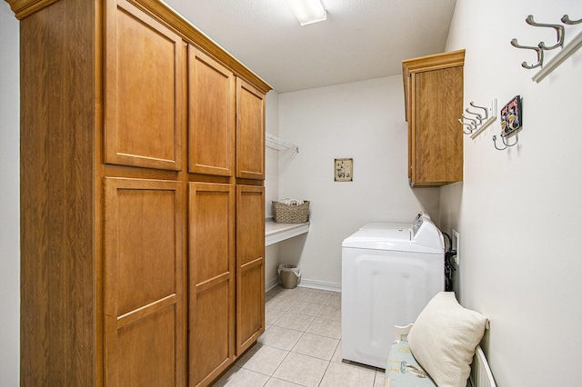 7853 Clydesdale Ave, Kalamazoo, MI 49009 - laundry room with washer / dryer, cabinet space, and light tile patterned floors