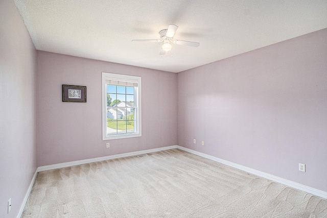 7853 Clydesdale Ave, Kalamazoo, MI 49009 - empty room featuring a ceiling fan, light colored carpet, and a textured ceiling