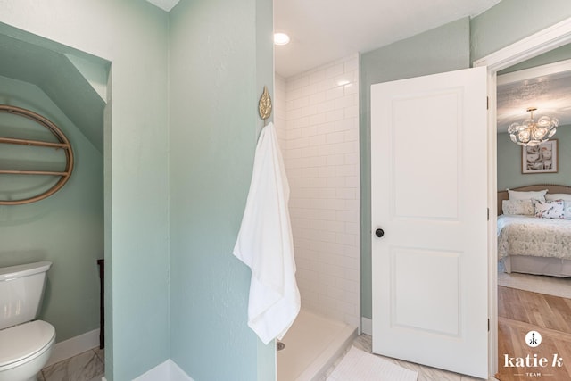 1002 Benjamin Ave SE, Grand Rapids, MI 49506 - bathroom with connected bathroom, a tile shower, and a chandelier