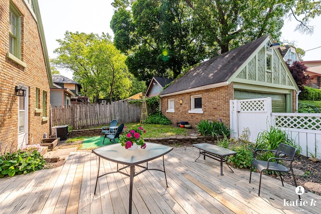 1002 Benjamin Ave SE, Grand Rapids, MI 49506 - deck featuring a fenced backyard and a detached garage