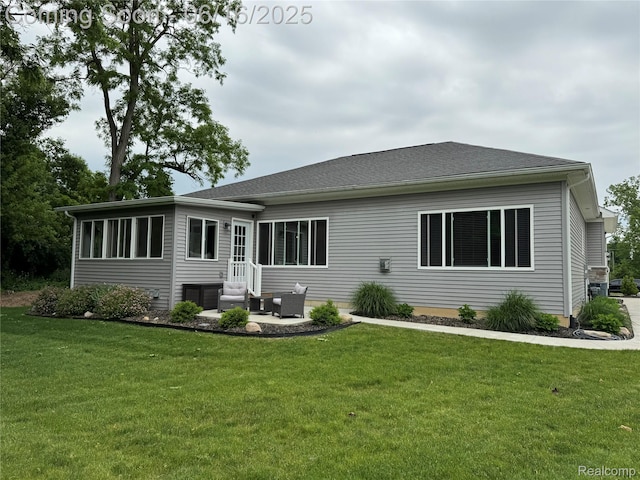 4020 Oak St, Grand Blanc, MI 48439 - back of house with a yard, entry steps, and a patio area
