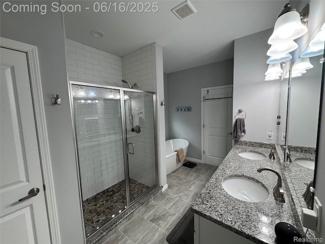 4020 Oak St, Grand Blanc, MI 48439 - bathroom with a stall shower, double vanity, and a freestanding bath