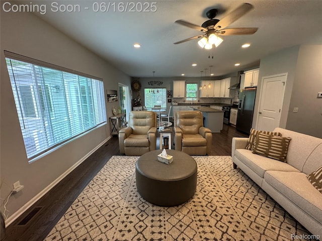 4020 Oak St, Grand Blanc, MI 48439 - living area featuring dark wood-style flooring, ceiling fan, and recessed lighting