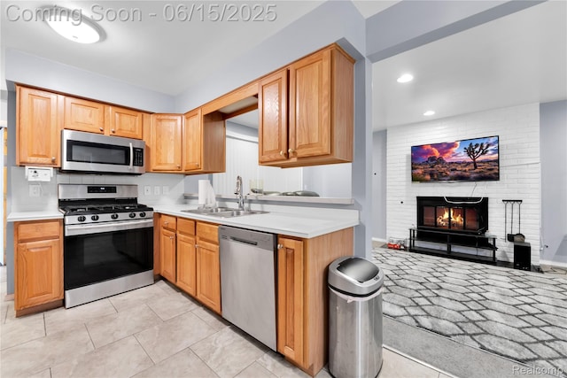 29464 Marshall St, Southfield, MI 48076 - kitchen featuring stainless steel appliances, light countertops, a fireplace, recessed lighting, and open floor plan