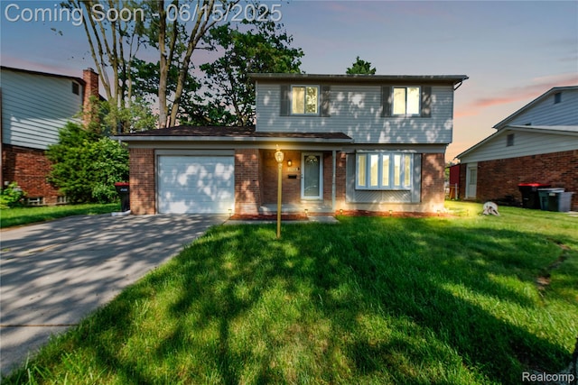 29464 Marshall St, Southfield, MI 48076 - view of front of house featuring brick siding, driveway, a garage, and a yard