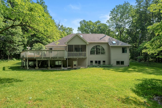 6916 Windsong Way, Kalamazoo, MI 49009 - back of house with a sunroom, a lawn, a wooden deck, and a shingled roof