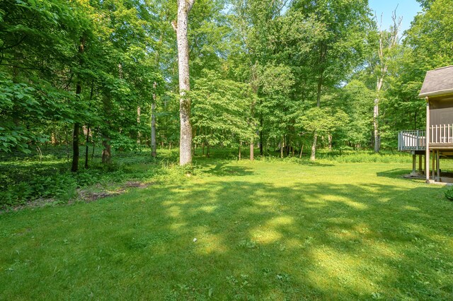 6916 Windsong Way, Kalamazoo, MI 49009 - view of green lawn featuring a deck