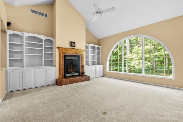 6916 Windsong Way, Kalamazoo, MI 49009 - unfurnished living room with high vaulted ceiling, carpet floors, a ceiling fan, and a fireplace
