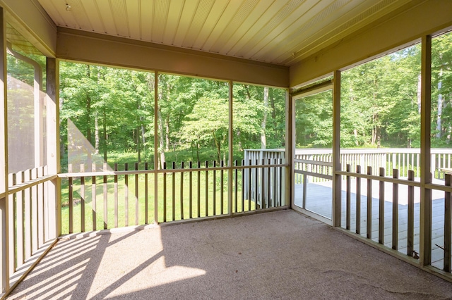 6916 Windsong Way, Kalamazoo, MI 49009 - unfurnished sunroom with view of wooded area