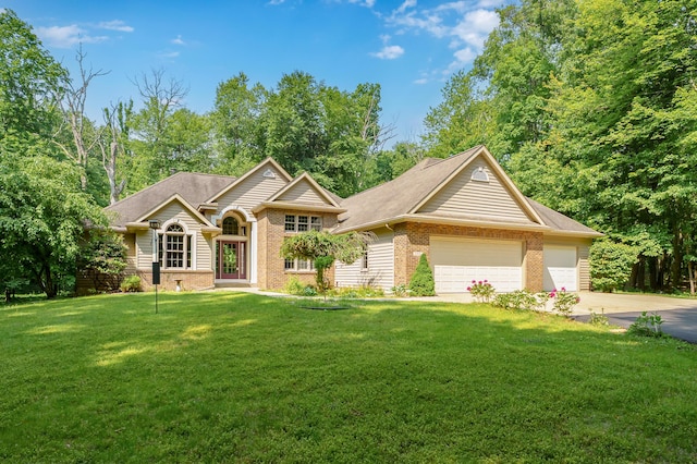 6916 Windsong Way, Kalamazoo, MI 49009 - view of front facade featuring brick siding, concrete driveway, an attached garage, and a front yard