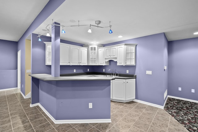 6916 Windsong Way, Kalamazoo, MI 49009 - kitchen with white cabinets, glass insert cabinets, light tile patterned flooring, recessed lighting, and track lighting