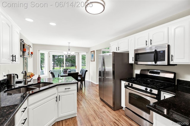 13563 Trotters Ln, Sterling Heights, MI 48313 - kitchen with appliances with stainless steel finishes, light wood-type flooring, white cabinets, dark stone counters, and recessed lighting