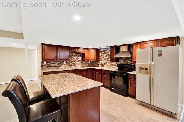 13563 Trotters Ln, Sterling Heights, MI 48313 - kitchen featuring white fridge with ice dispenser, black electric range, wall chimney exhaust hood, backsplash, and recessed lighting