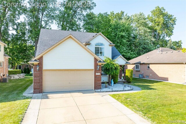13563 Trotters Ln, Sterling Heights, MI 48313 - traditional-style home with concrete driveway, brick siding, a garage, a front lawn, and roof with shingles