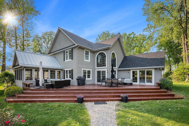 1415 Blackhawk Trl, Benton Harbor, MI 49022 - rear view of property with an outdoor living space, a lawn, a chimney, a deck, and roof with shingles