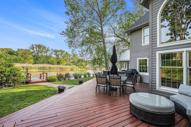 1415 Blackhawk Trl, Benton Harbor, MI 49022 - wooden deck featuring a water view, outdoor dining area, a yard, and area for grilling