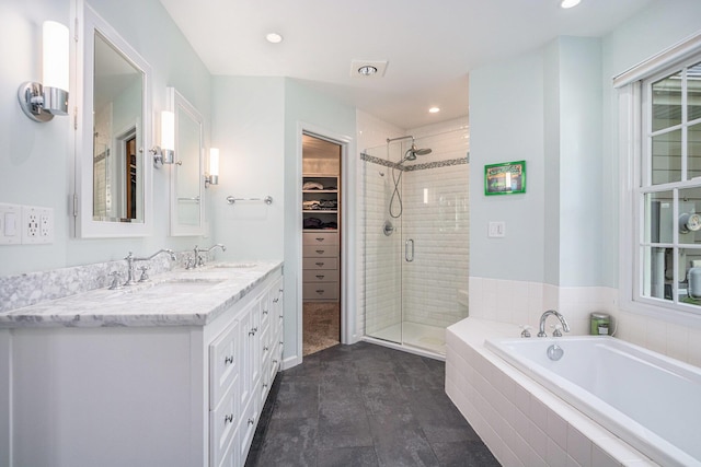 1415 Blackhawk Trl, Benton Harbor, MI 49022 - full bath with a shower stall, a garden tub, double vanity, a spacious closet, and recessed lighting