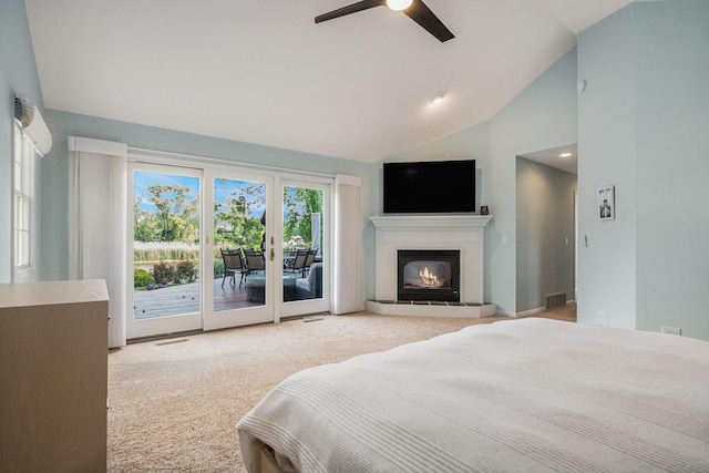 1415 Blackhawk Trl, Benton Harbor, MI 49022 - carpeted bedroom with access to exterior, a glass covered fireplace, a ceiling fan, and high vaulted ceiling