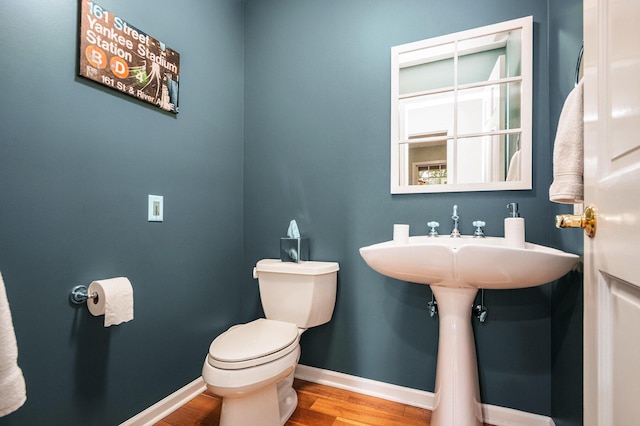 1415 Blackhawk Trl, Benton Harbor, MI 49022 - bathroom featuring toilet and wood finished floors
