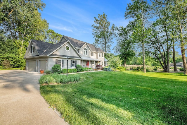 1415 Blackhawk Trl, Benton Harbor, MI 49022 - view of front of house with a garage, driveway, a front lawn, and a porch