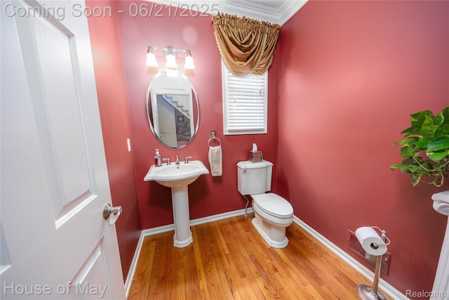 1768 Carriage Hl, Commerce Twp, MI 48382 - half bath featuring wood finished floors and ornamental molding