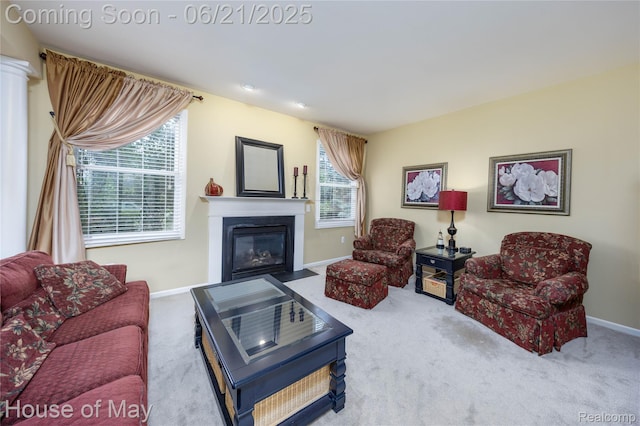 1768 Carriage Hl, Commerce Twp, MI 48382 - living room featuring carpet flooring and a fireplace with flush hearth