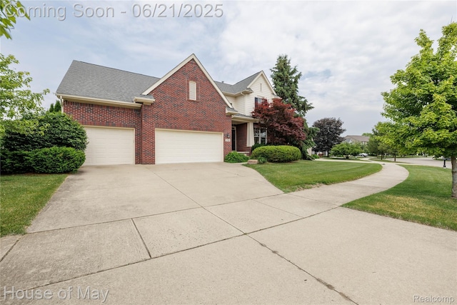 1768 Carriage Hl, Commerce Twp, MI 48382 - traditional home featuring brick siding, an attached garage, driveway, and a front yard
