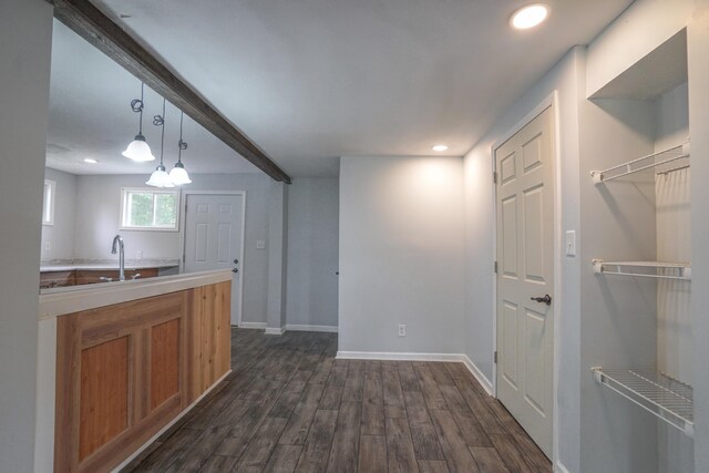 879 Carberry Rd, Niles, MI 49120 - kitchen with dark wood-style flooring, recessed lighting, brown cabinets, decorative light fixtures, and light countertops