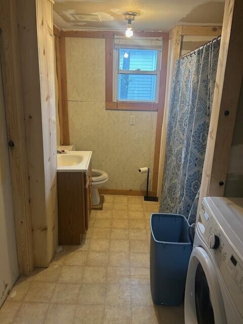 844 N Oak St, Evart, MI 49631 - full bathroom with washer / clothes dryer, tile patterned floors, and vanity