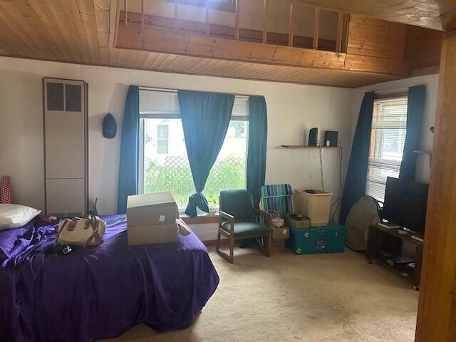 844 N Oak St, Evart, MI 49631 - carpeted bedroom with wooden ceiling