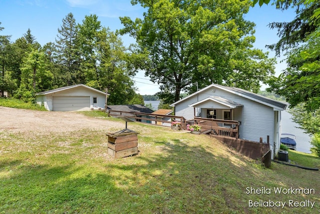 1725 Ottawa Trl, Hastings, MI 49058 - view of grassy yard with a garage and an outbuilding