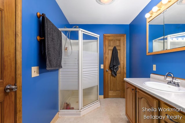 1725 Ottawa Trl, Hastings, MI 49058 - bathroom featuring a stall shower, vanity, and tile patterned floors