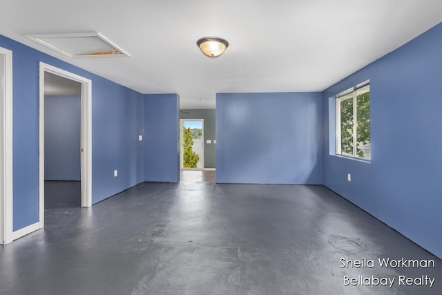1725 Ottawa Trl, Hastings, MI 49058 - spare room with finished concrete floors and attic access