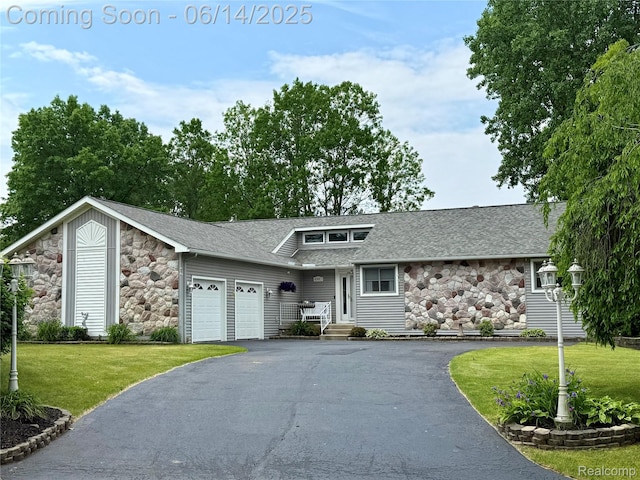 4960 Paula Ave, Clarkston, MI 48346 - mid-century modern home featuring stone siding, driveway, a garage, a front lawn, and roof with shingles